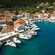 A stunning port village with boats in the water and colorful homes